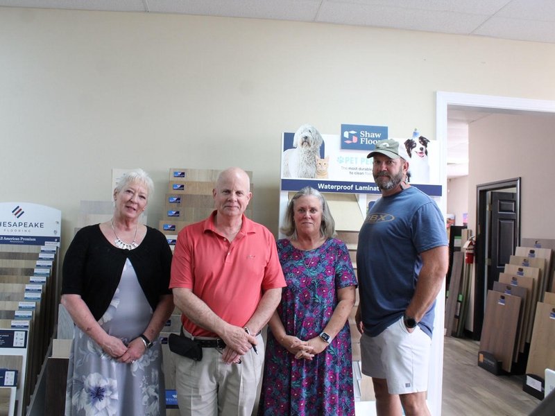 The Boyd's Carpet team standing together inside their Winterville, NC showroom.